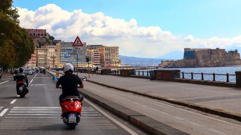 Riding a vespa in Naples Italy